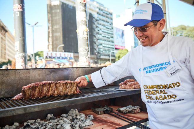 Nothing puts a smile on a parillero's face more than turning the asado. Photo courtesy of BACapitalGastronomica.